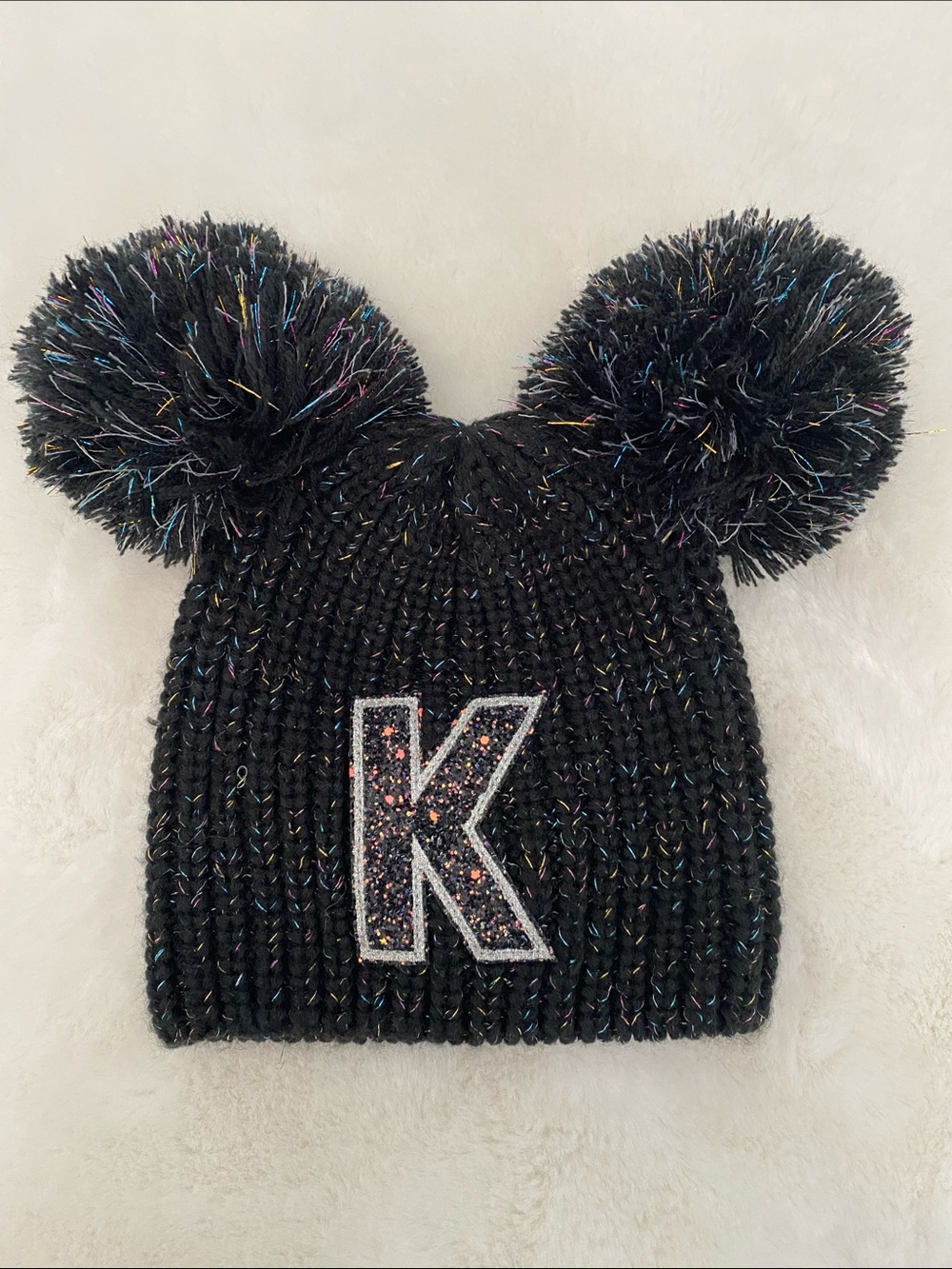 Justice Black Knit Beanie with Double Pom Poms and Glitter 'K' Patch